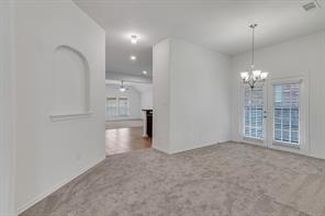 13117 Larks View Point Fort Worth, TX 76244 - Photo 2 of 26 a view of an empty room with a kitchen