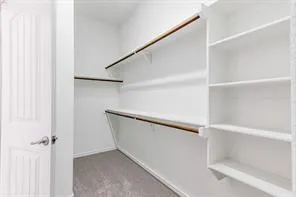 a spacious bathroom with a granite countertop sink mirror and a shower