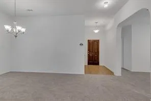 a view of a chandelier in an empty room