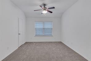 13117 Larks View Point Fort Worth, TX 76244 - Photo 6 of 26 an empty room with fan and windows