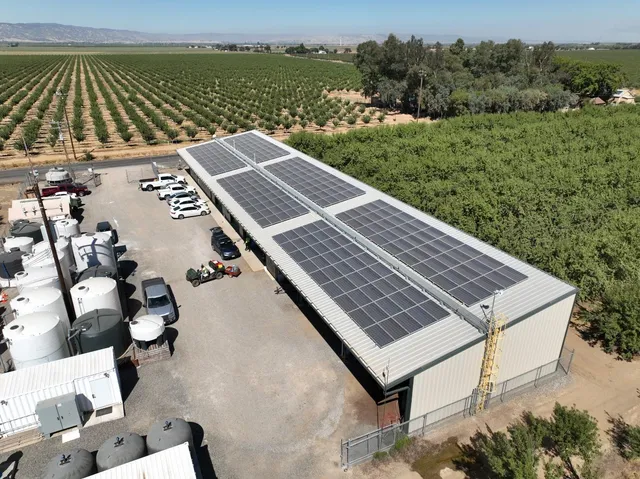 a roof deck with table and chairs a barbeque