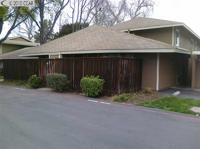 2073 Olivera Road, Unit A Concord, CA 94520 - Photo 1 of 1 a front view of house with yard and trees around