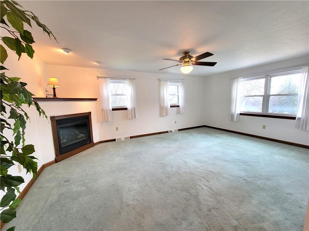 2013 Cutter Drive McKees Rocks, PA 15136 - Photo 11 of 25 an empty room with windows and fireplace
