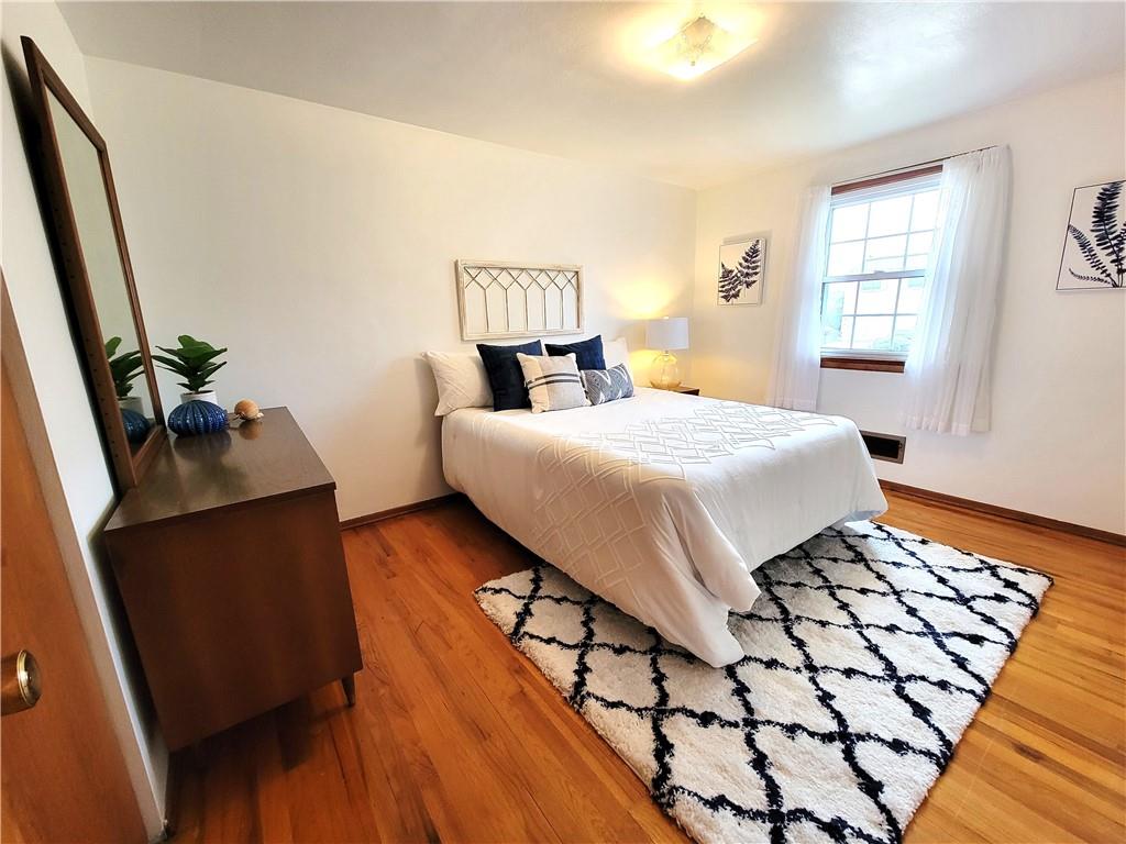 2013 Cutter Drive McKees Rocks, PA 15136 - Photo 16 of 25 a bedroom with a bed and wooden floor