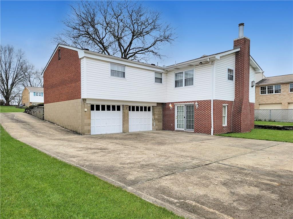 2013 Cutter Drive McKees Rocks, PA 15136 - Photo 2 of 25 a view of a house with a yard and garage