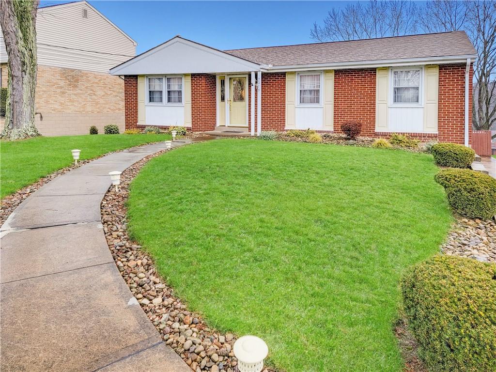 2013 Cutter Drive McKees Rocks, PA 15136 - Photo 25 of 25 a front view of a house with a garden and yard
