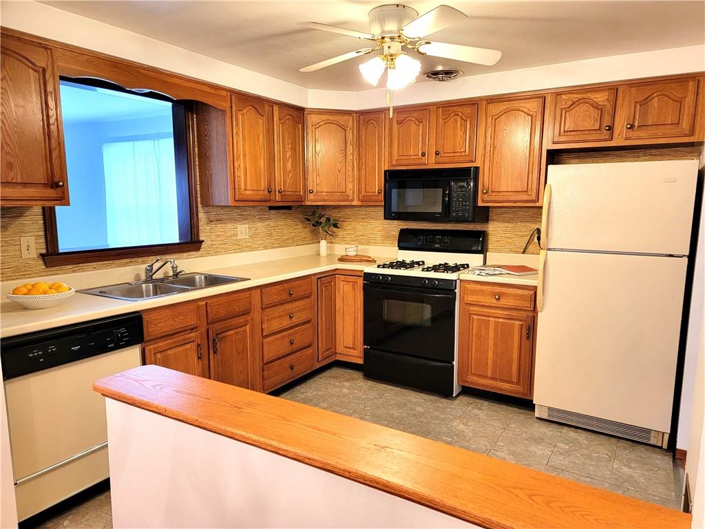 2013 Cutter Drive McKees Rocks, PA 15136 - Photo 6 of 25 a kitchen with a sink stove and microwave