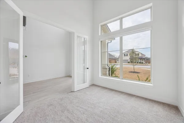 a view of an empty room with a window