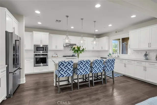 a kitchen with a sink cabinets and window