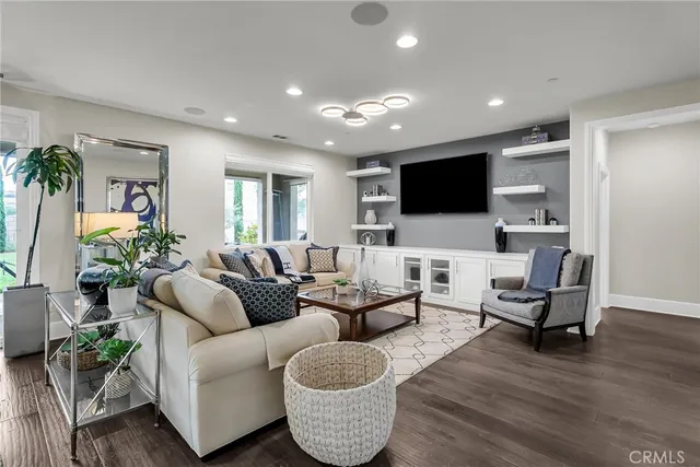 a bathroom with a granite countertop sink a toilet and a mirror