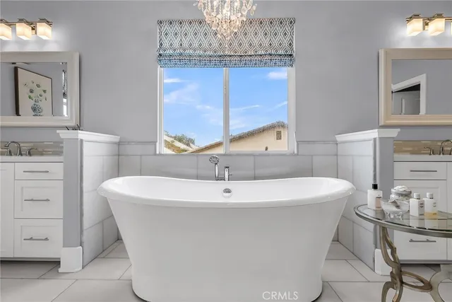 a bedroom with a bed window and couch