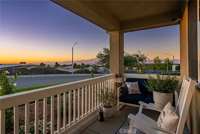 a view of balcony with furniture