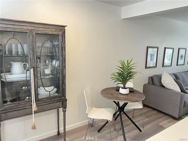 a living room with furniture and a glass door