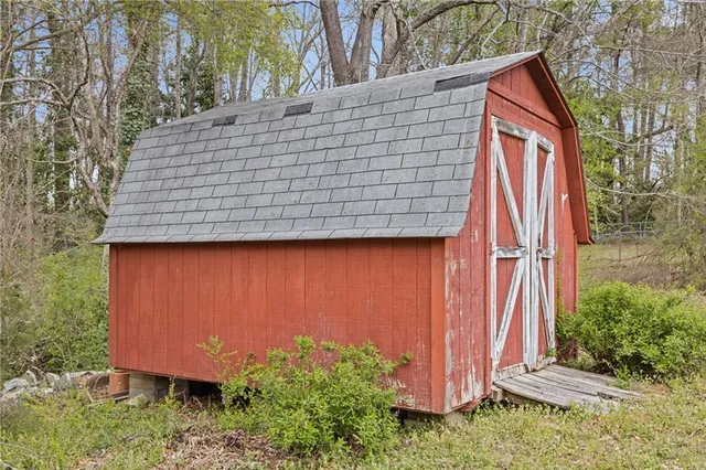 a swimming pool with trees in the background