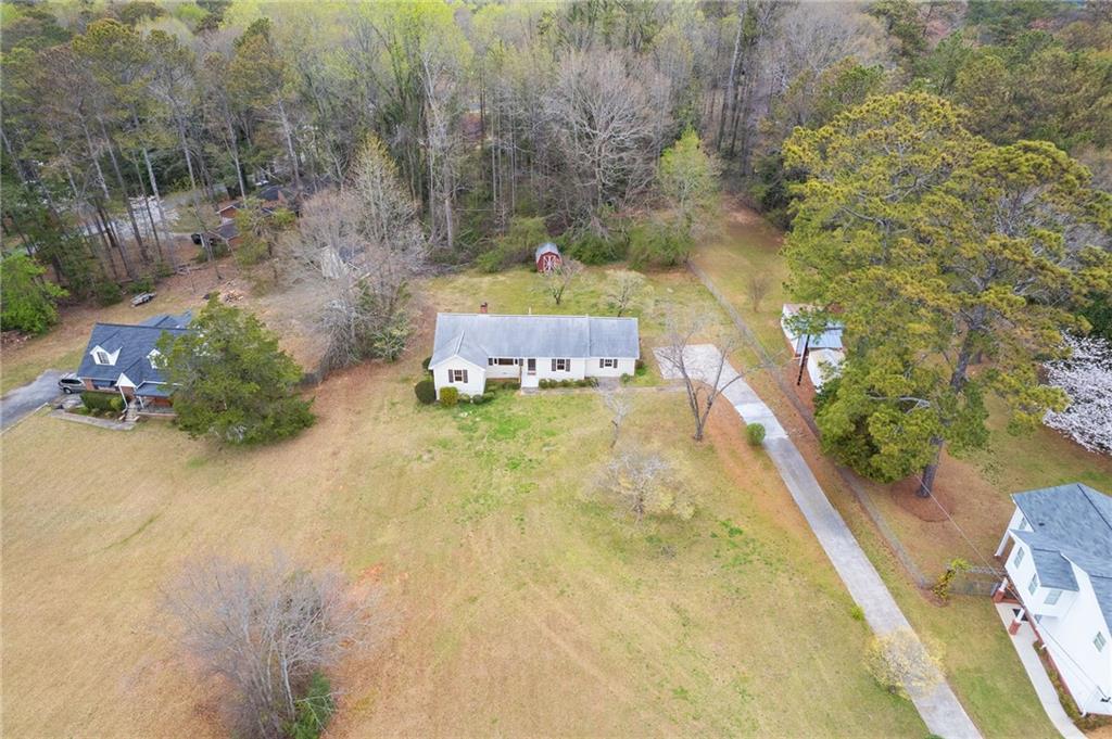 1312 Milstead Avenue Conyers, GA 30012 - Photo 31 of 34 a swimming pool with plants