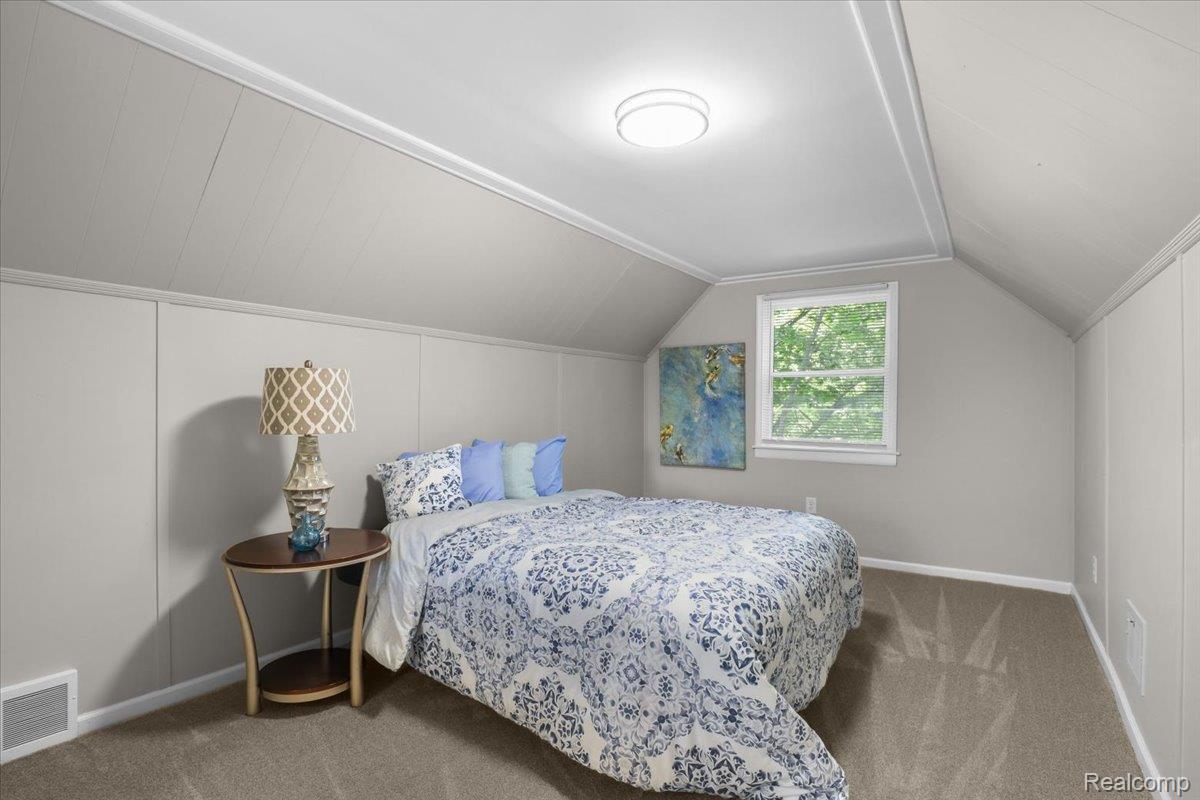 43600 Crowley Road Belleville, MI 48111 - Photo 22 of 33 Carpeted room featuring sloped ceilings with white trim, a single-pane window, and light gray paneling