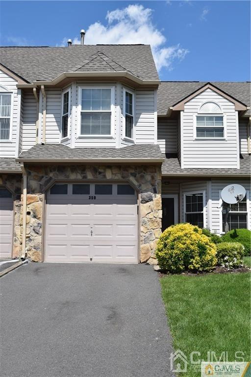 348 Lunar Road Piscataway, NJ 08854 - Photo 2 of 33 a front view of a house with a garden