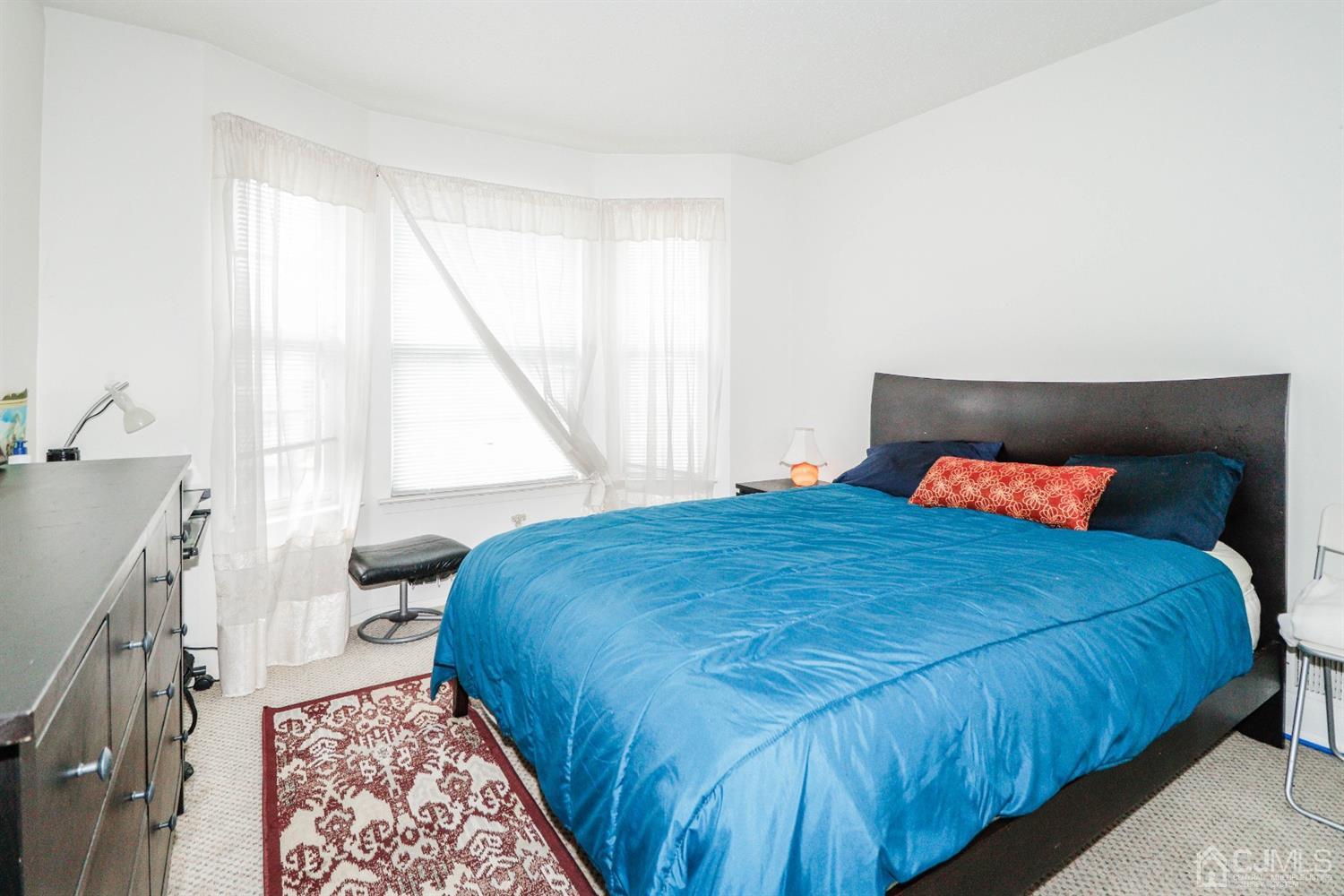 348 Lunar Road Piscataway, NJ 08854 - Photo 14 of 33 a bedroom with a bed and a window