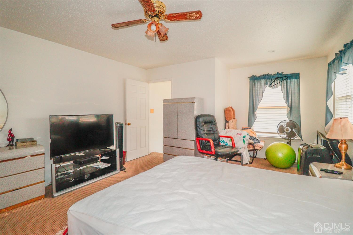 348 Lunar Road Piscataway, NJ 08854 - Photo 19 of 33 a living room with furniture and a flat screen tv