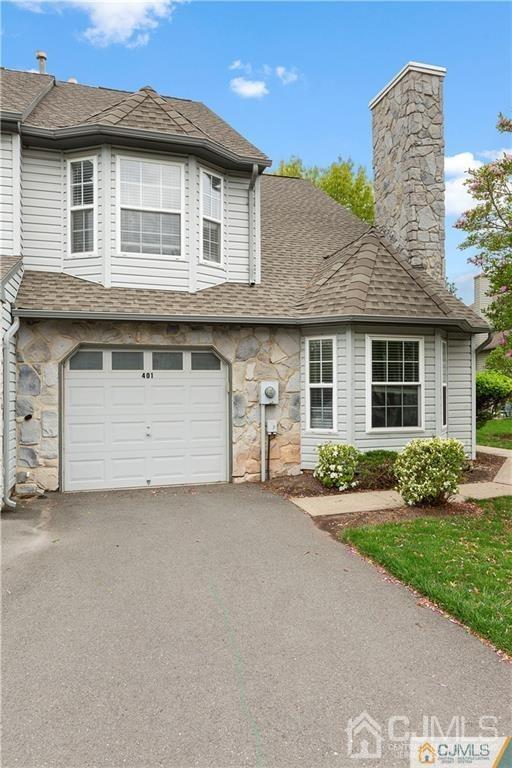 348 Lunar Road Piscataway, NJ 08854 - Photo 5 of 33 a front view of a house with a yard and garage