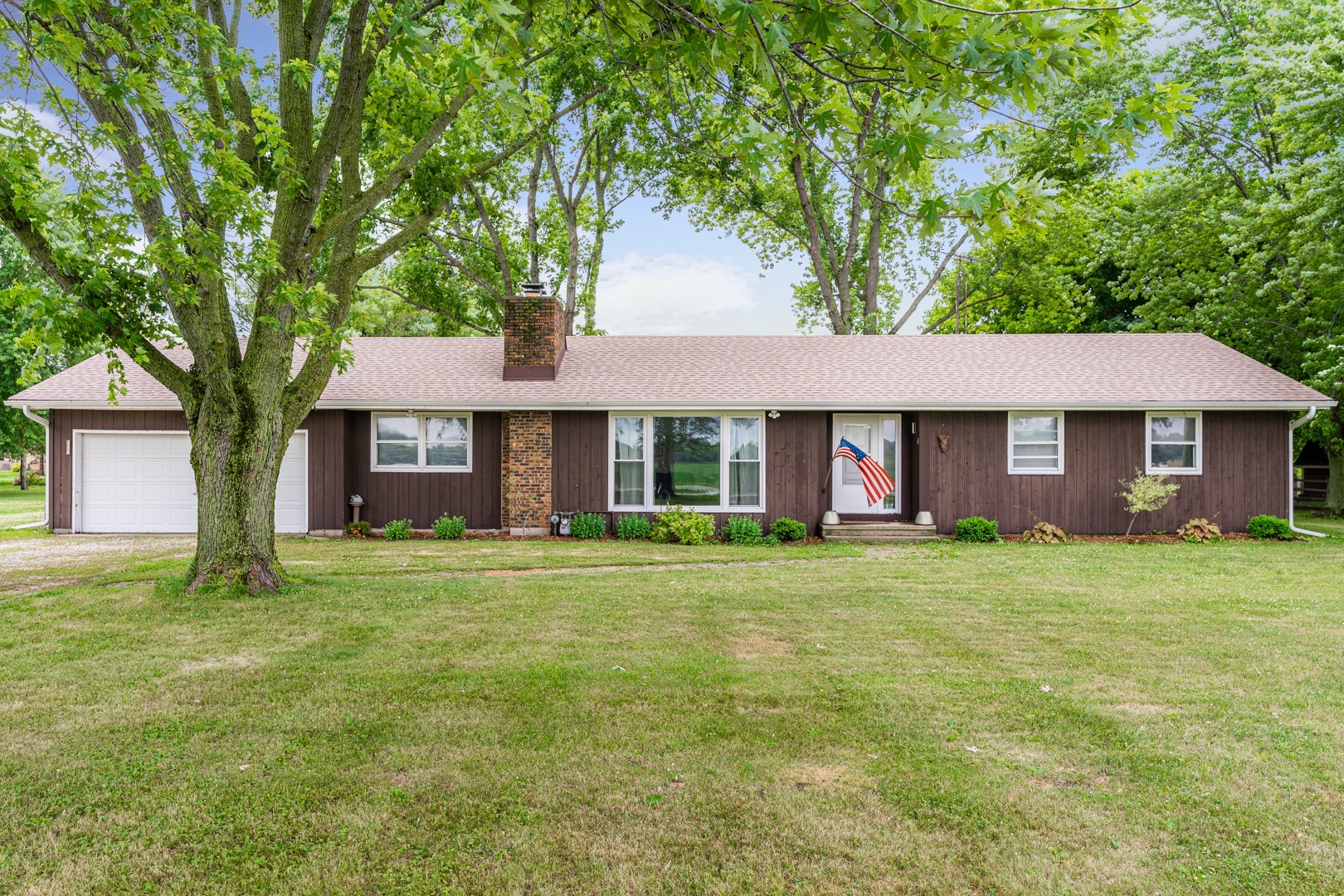 48W323 Keslinger Road Maple Park, IL 60151 - Photo 1 of 31 a front view of a house with a garden