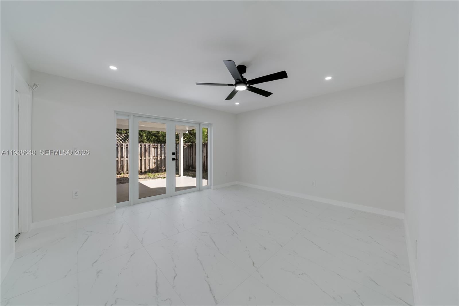 9826 Southwest 222nd Terrace, Unit 9826 Cutler Bay, FL 33190 - Photo 17 of 36 a view of an empty room with a window