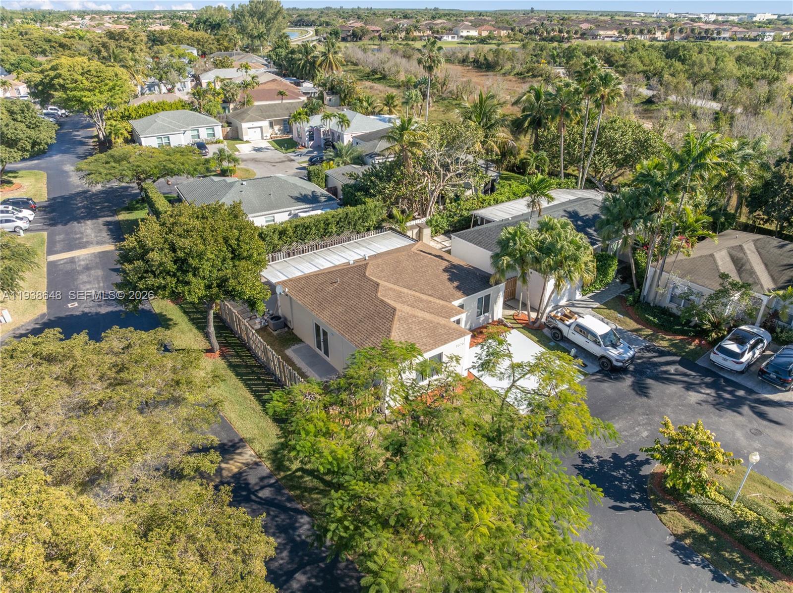 9826 Southwest 222nd Terrace, Unit 9826 Cutler Bay, FL 33190 - Photo 27 of 36 an aerial view of residential houses with outdoor space