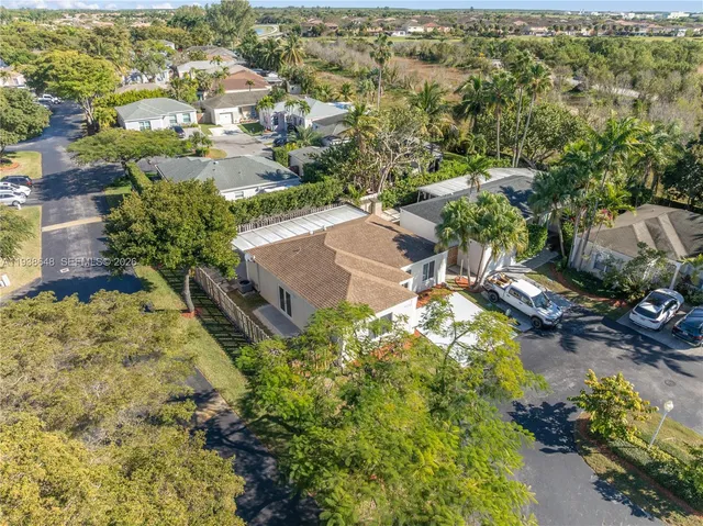 an aerial view of residential houses with outdoor space
