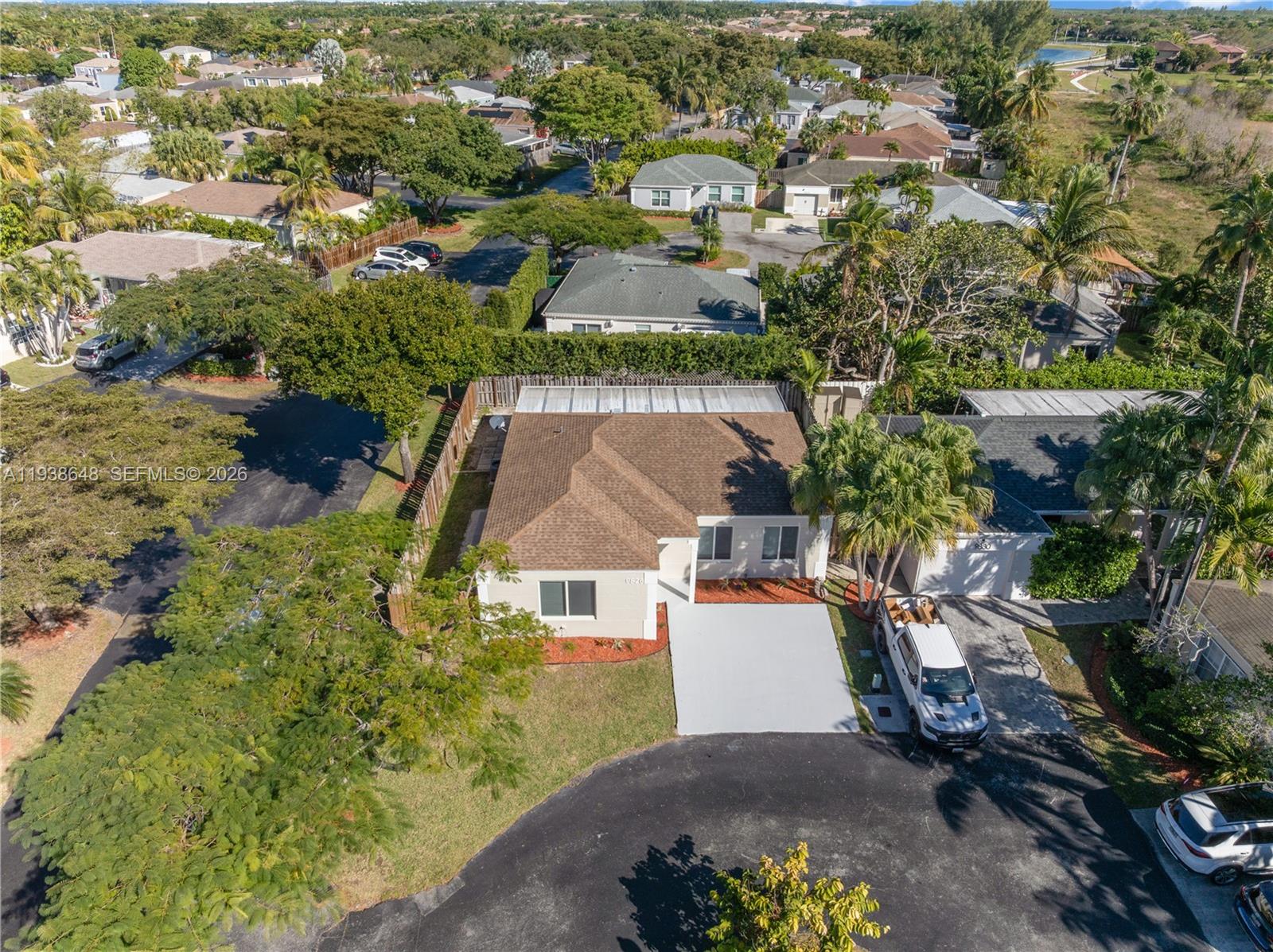9826 Southwest 222nd Terrace, Unit 9826 Cutler Bay, FL 33190 - Photo 30 of 36 an aerial view of a house with a yard