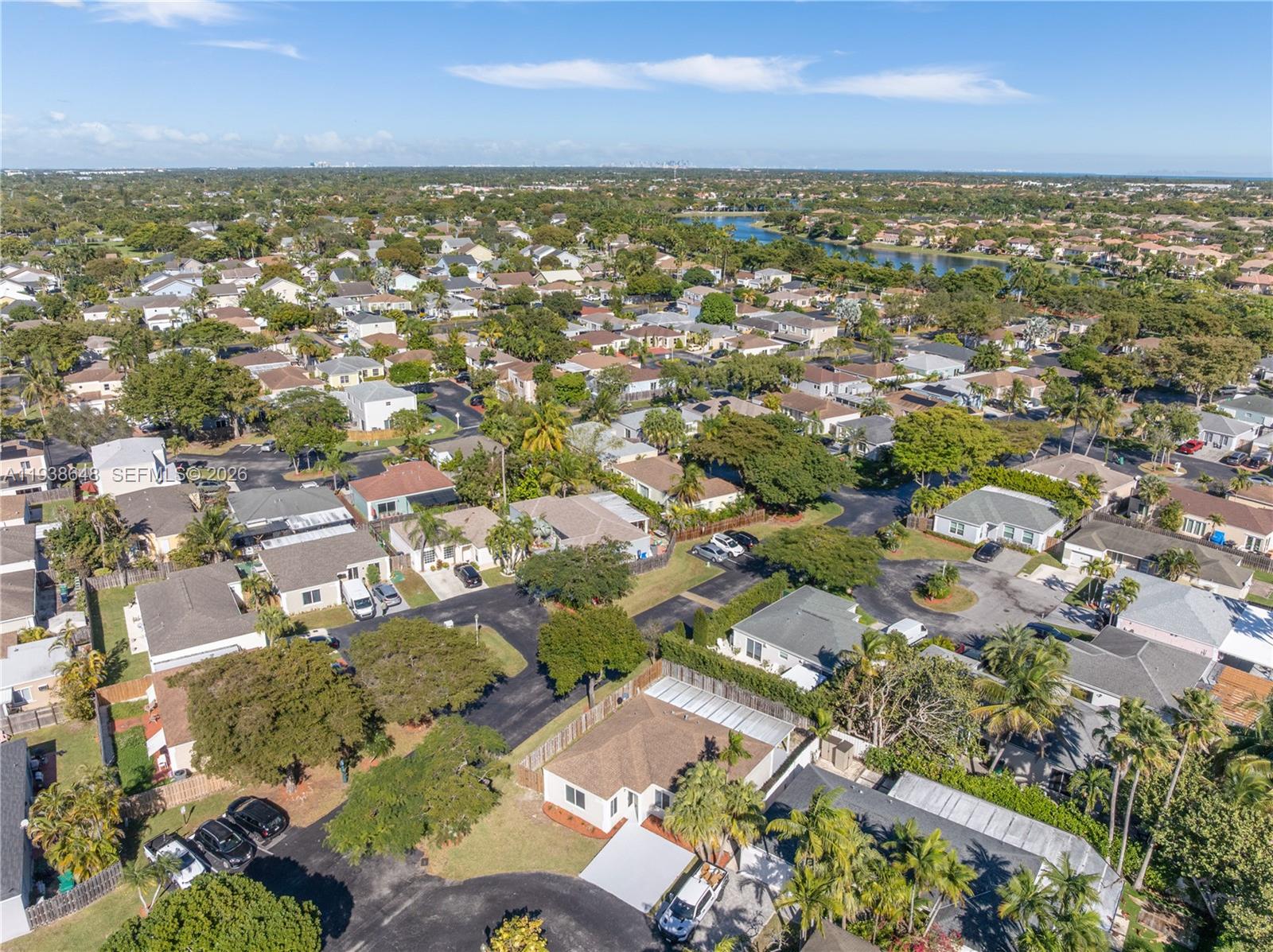 9826 Southwest 222nd Terrace, Unit 9826 Cutler Bay, FL 33190 - Photo 31 of 36 an aerial view of residential building with parking space