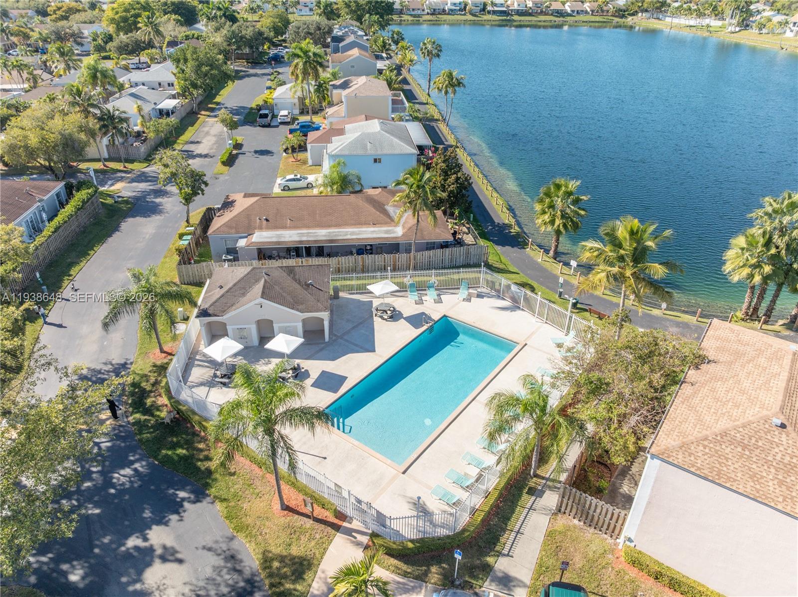 9826 Southwest 222nd Terrace, Unit 9826 Cutler Bay, FL 33190 - Photo 34 of 36 an aerial view of a house with a yard and lake view