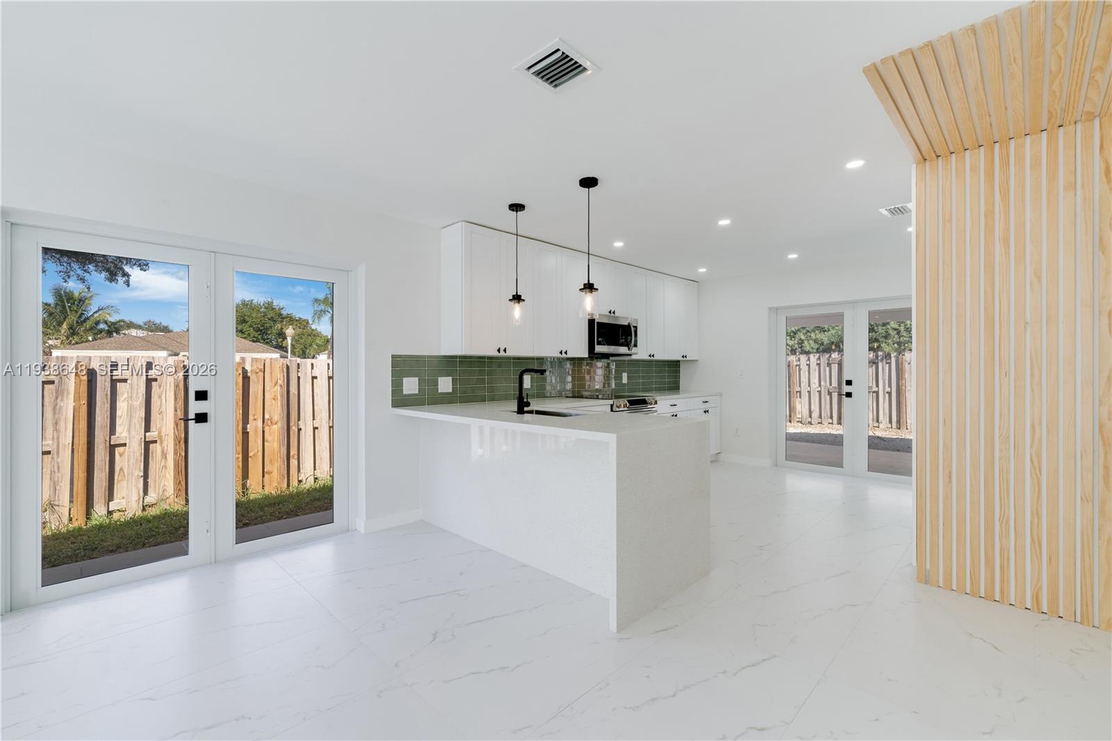 9826 Southwest 222nd Terrace, Unit 9826 Cutler Bay, FL 33190 - Photo 8 of 36 a view of kitchen with stainless steel appliances refrigerator oven