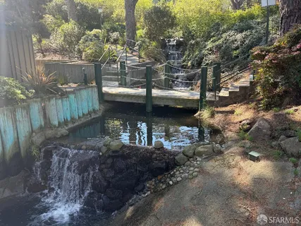 a backyard of a house with outdoor seating