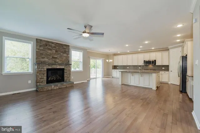 a view of kitchen with cabinets and wooden floor