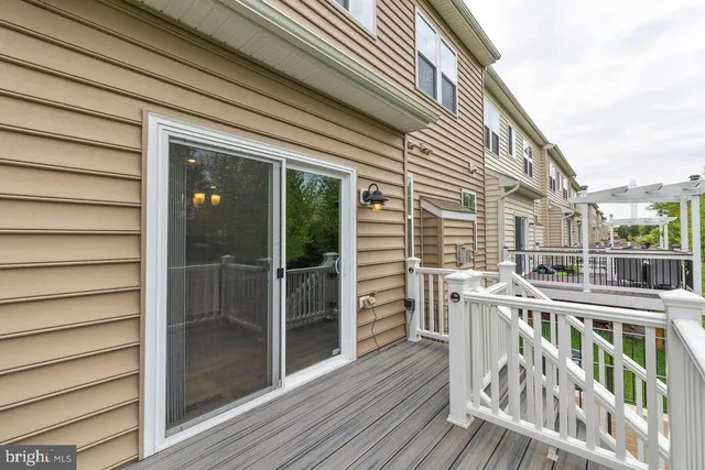 a balcony with table and chairs