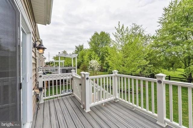 a view of a balcony with wooden floor