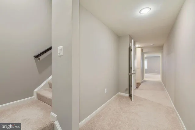 a view of closet with wooden floor