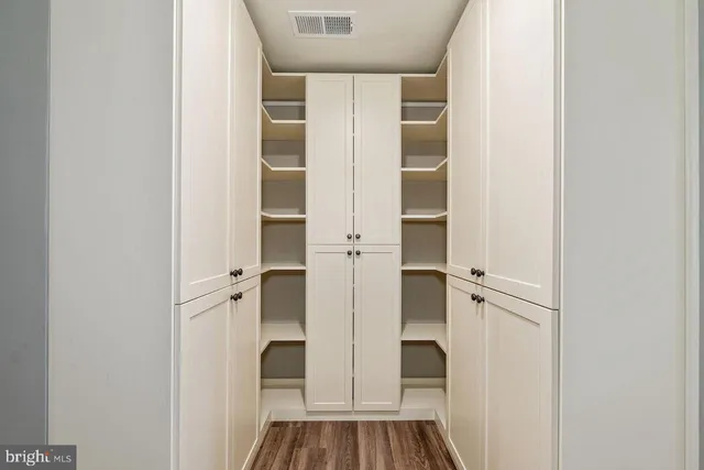 a view of an empty room with windows