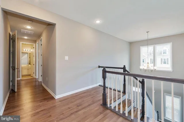 a view of a livingroom with a ceiling fan and window
