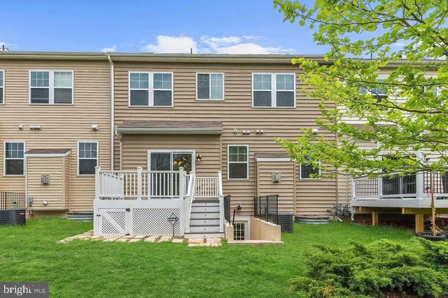 a view of an empty room with windows