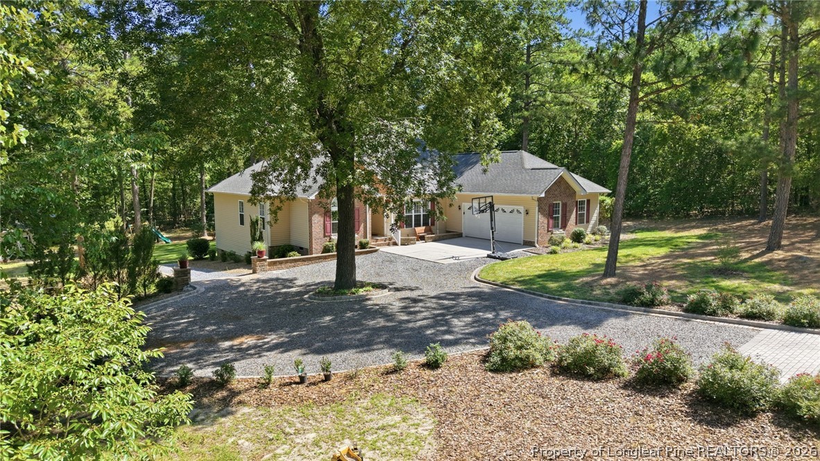 16 Ridge Road Jackson Springs, NC 27281 - Photo 3 of 50 a front view of a house with a yard and large tree