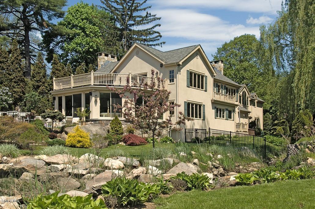 33 Twin Lakes Lane Riverside, CT 06878 - Photo 1 of 11 a front view of a house with garden