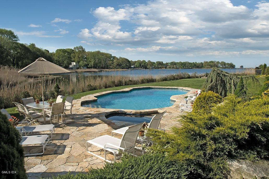 33 Twin Lakes Lane Riverside, CT 06878 - Photo 8 of 11 a view of a lake with a patio