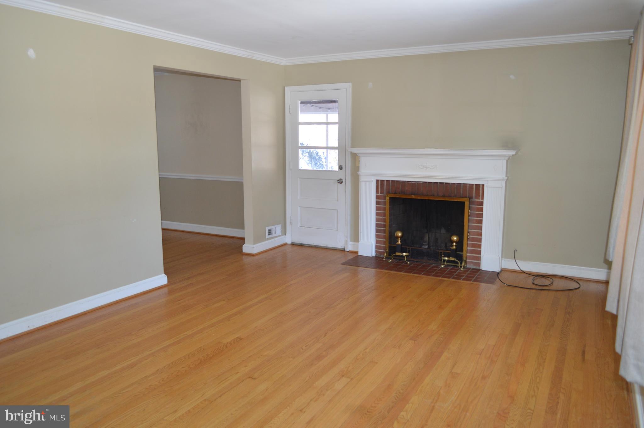 10110 Portland Road Silver Spring, MD 20901 - Photo 3 of 39 Bright living room with mantle and fireplace