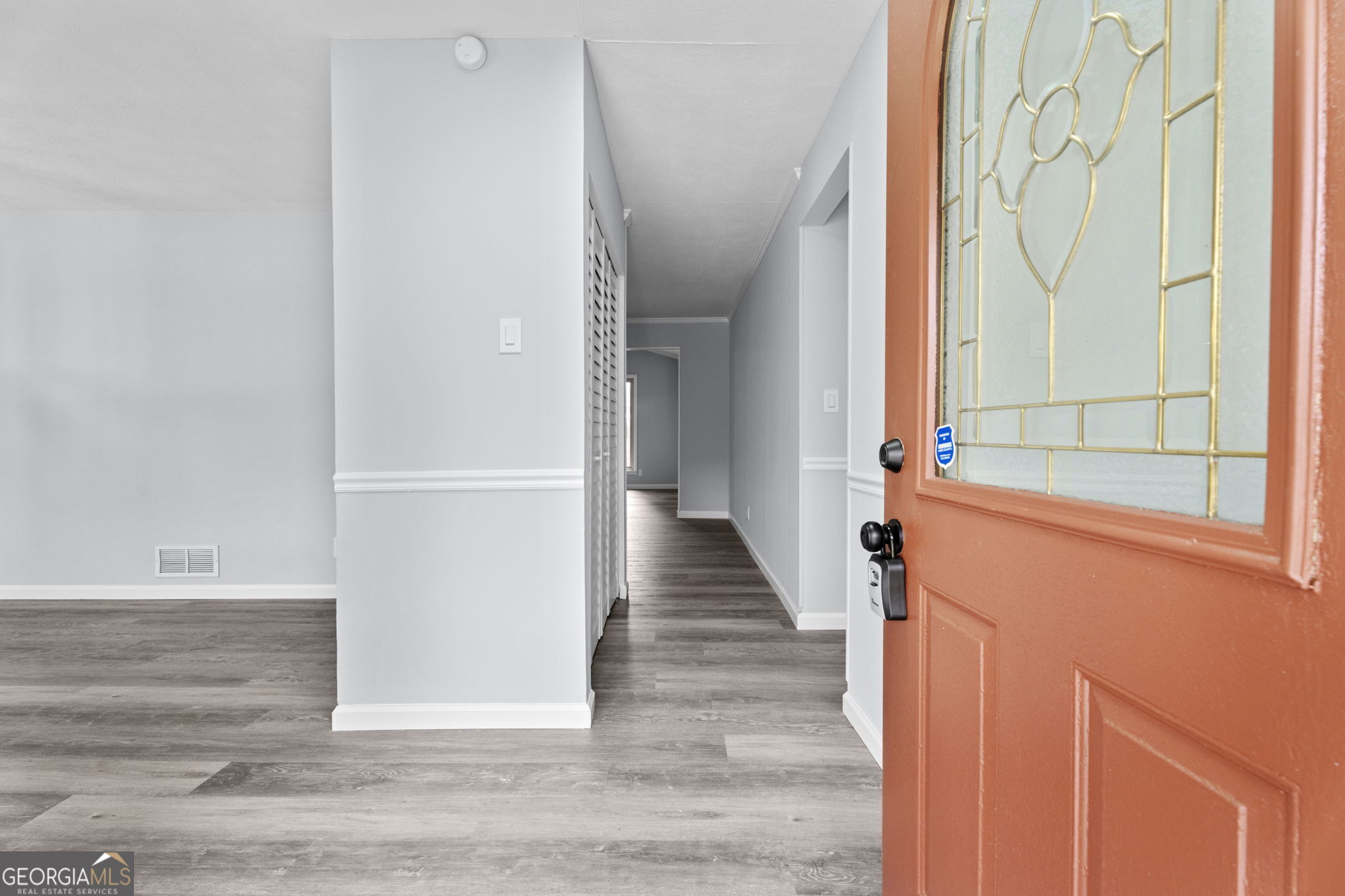 6463 Maddox Road Morrow, GA 30260 - Photo 4 of 46 a view of a hallway with wooden floor and staircase