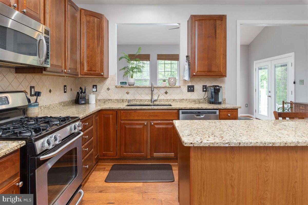 7813 Callington Way Hanover, MD 21076 - Photo 7 of 41 Cherry cabinets & stainless steel appliances.