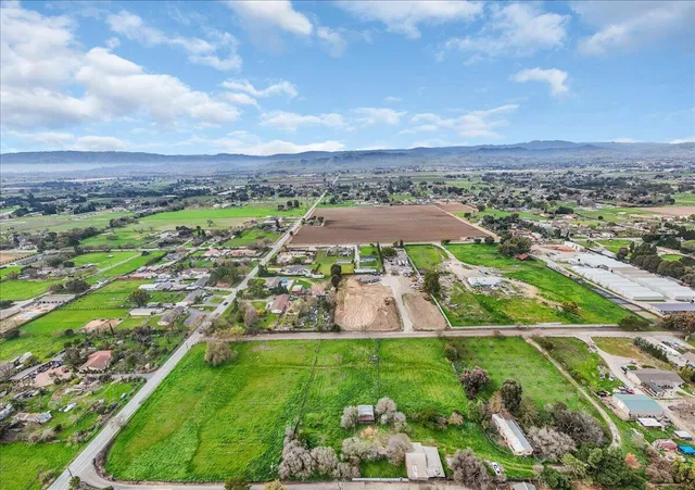 a view of a table and chairs in the garden
