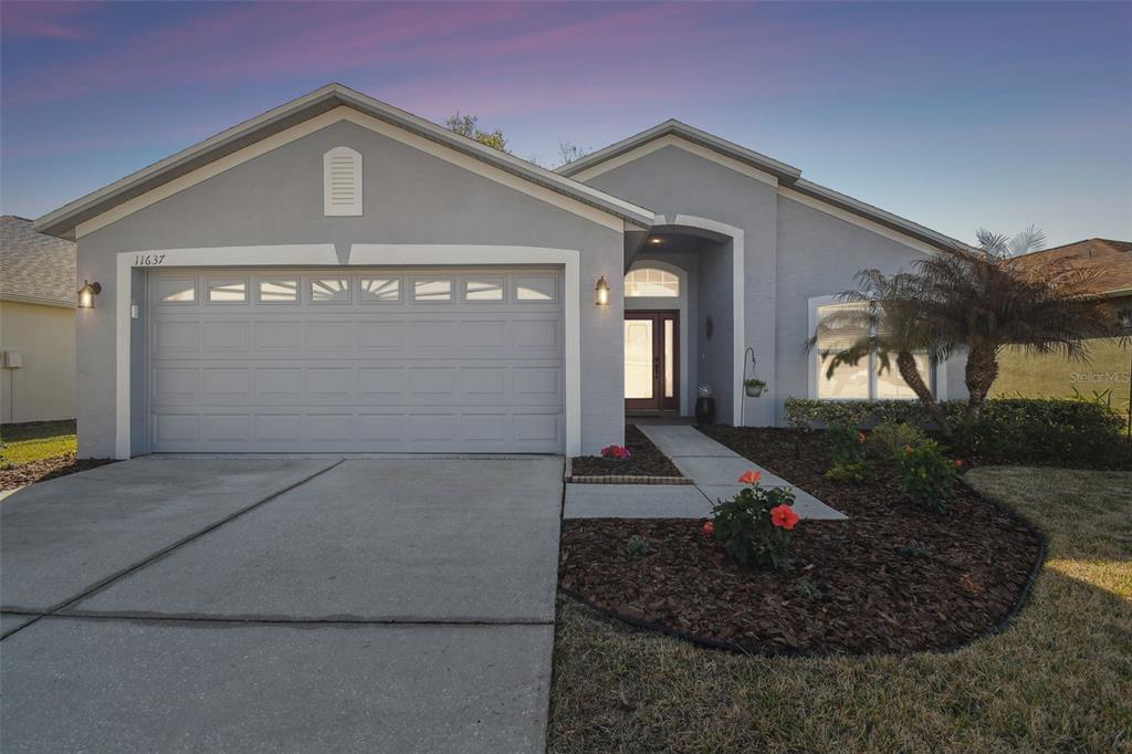 11637 Spindrift Loop Hudson, FL 34667 - Photo 1 of 1 a front view of a house
