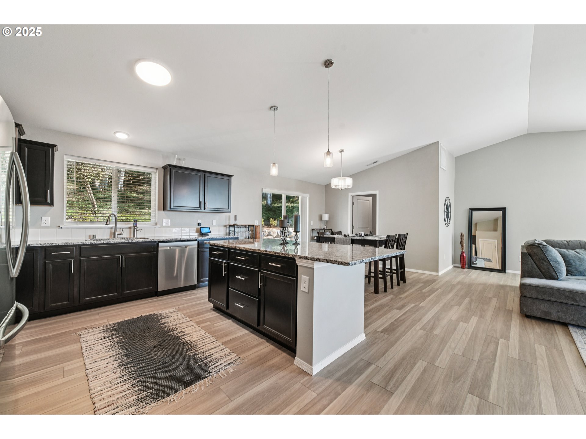 9 Curtis Lane Longview, WA 98632 - Photo 11 of 37 a kitchen with a sink cabinets and wooden floor