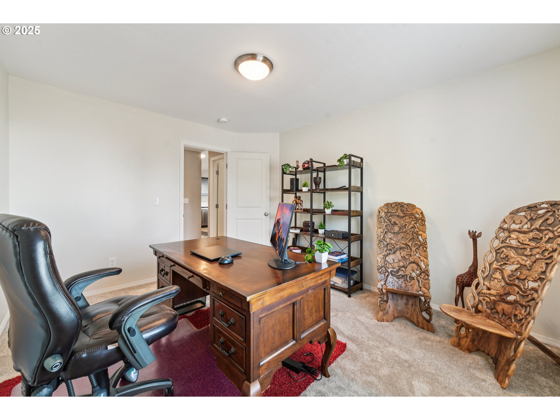 9 Curtis Lane Longview, WA 98632 - Photo 27 of 37 a living room with furniture a desk and bookshelf